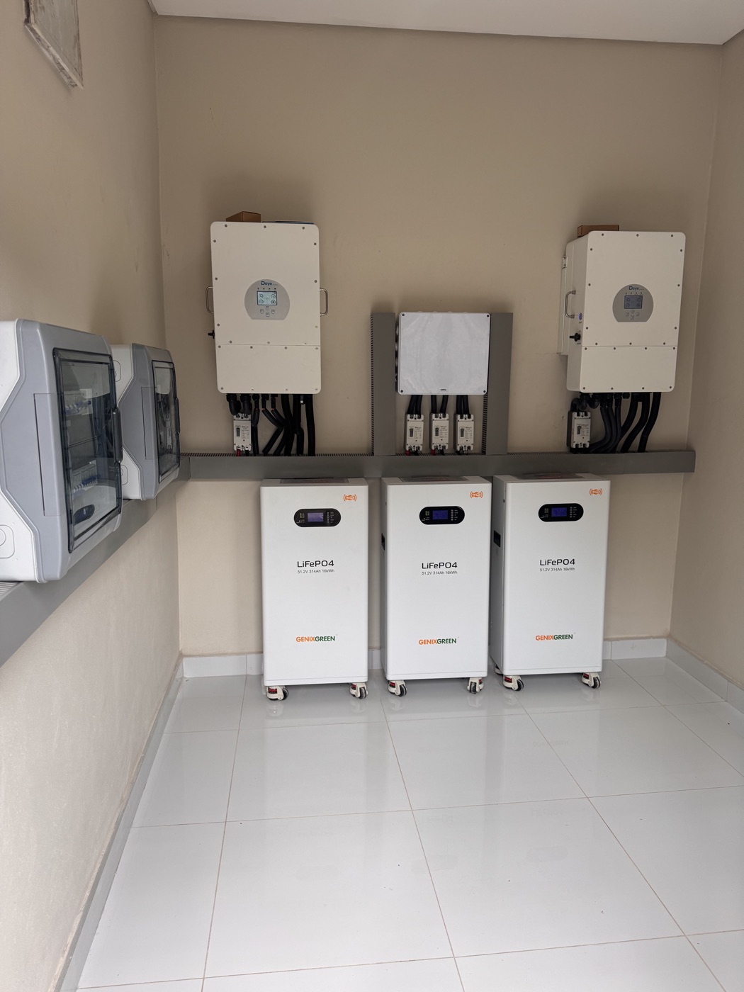 Three Deye hybrid inverters and three GenixGreen LiFePO4 battery cabinets in the Tamani power room